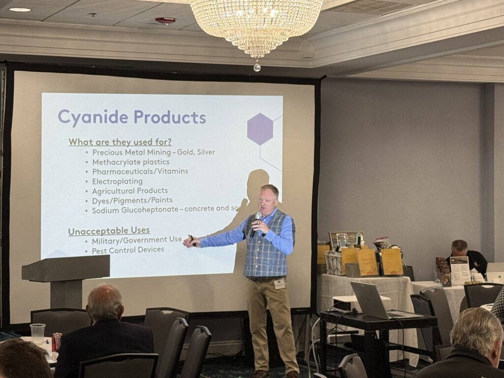A man speaking on cyanide products at the regional conference