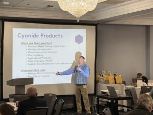 A man speaking on cyanide products at the regional conference
